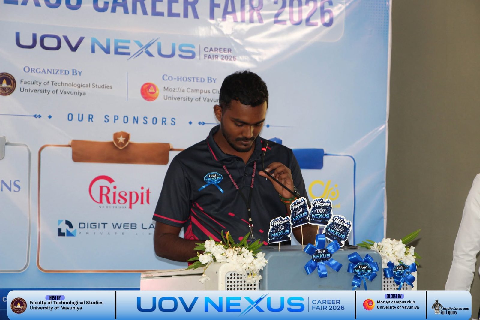 Accron Revolutions speaking at the podium during the University of Vavuniya NEXUS Career Fair 2026 opening
